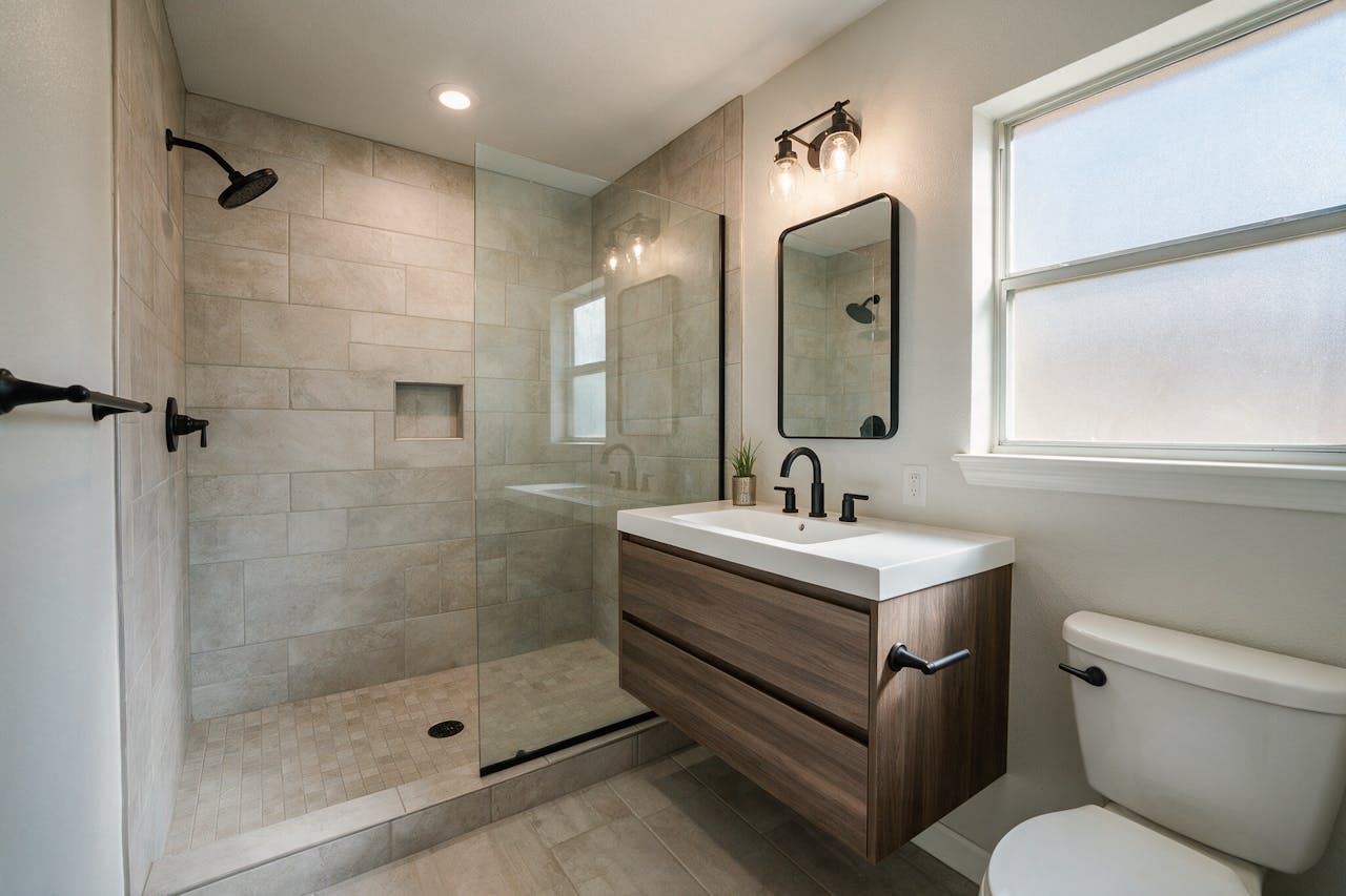 A finished bathroom remodel with a tiled walk-in shower
