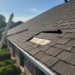 Missing roof shingles exposing tar paper on DFW home, cost to replace shingles visible damage